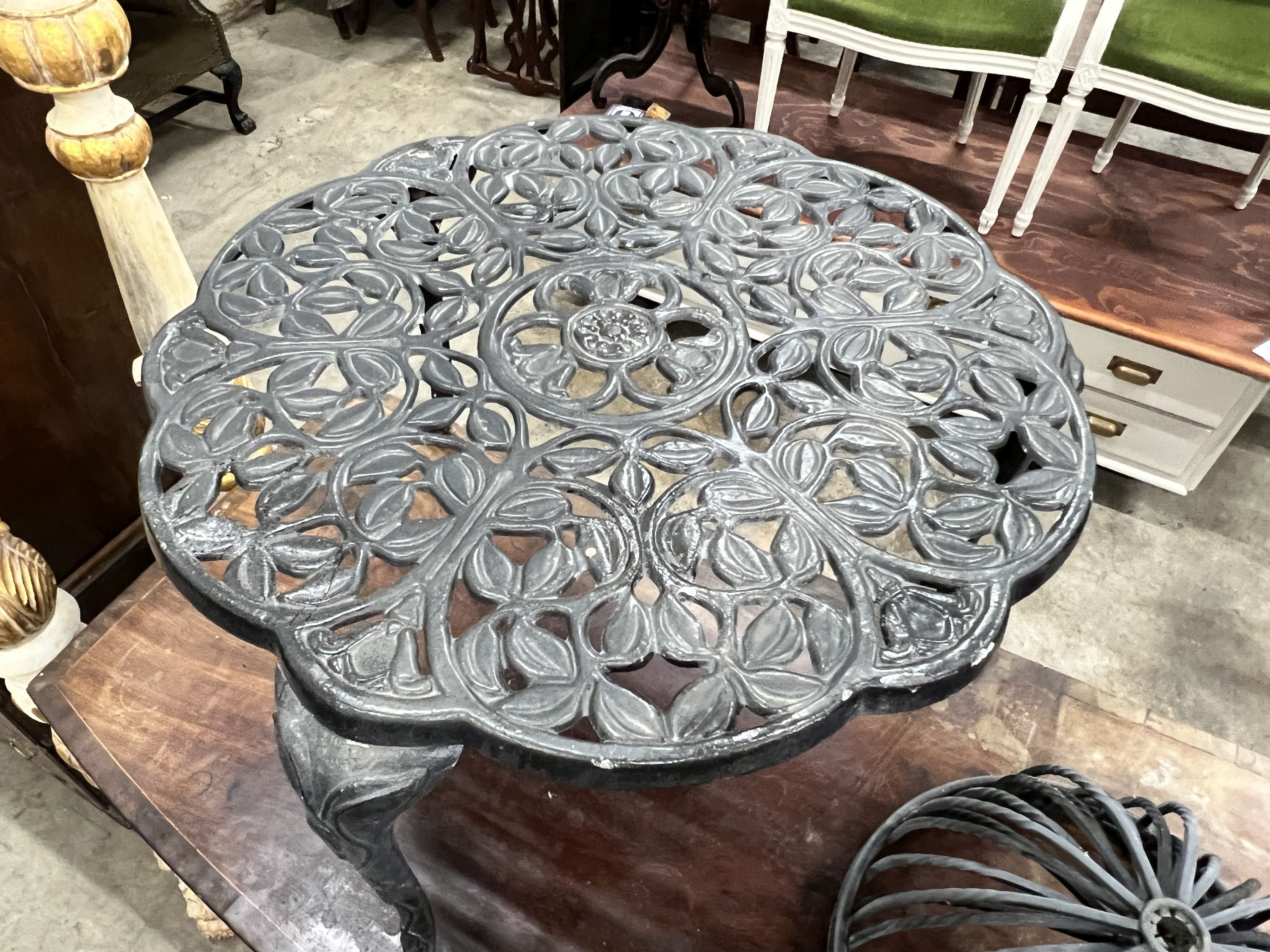 A circular aluminium low garden table, diameter 63cm, height 43cm together with four planter frames